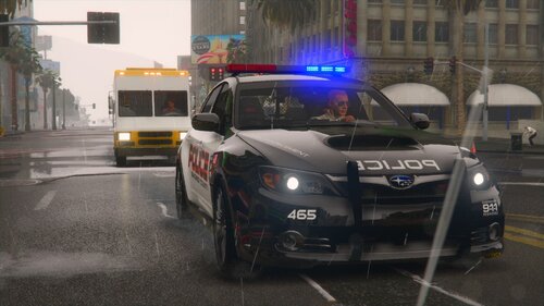 Could contain: land vehicle, vehicle, wheel, text, transport, outdoor, tire, building, road, automotive design, vehicle registration plate, automotive lighting, auto part, police, street, motor vehicle, car, city, light, driving