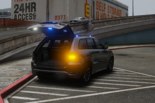 Could contain: vehicle, land vehicle, wheel, road, outdoor, tire, auto part, automotive lighting, building, automotive exterior, automotive tail & brake light, street, transport, taxi, automotive design, car, ground, light, police