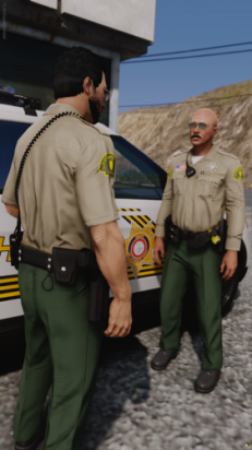 Could contain: person, outdoor, clothing, vehicle, military uniform, land vehicle, trousers, law enforcement, man, footwear, car, security, officer, ground, police