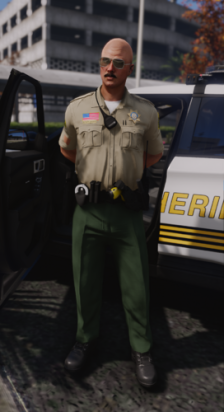 Could contain: clothing, person, outdoor, vehicle, land vehicle, car, man, law enforcement, wheel, building, military uniform, tire, police