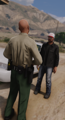 Could contain: clothing, outdoor, person, ground, car, trousers, vehicle, man, sky, land vehicle, footwear, hiking, wheel, tire, mountain, desert, standing